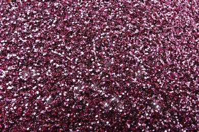 Photo of Texture of rose gold glitter as background, closeup