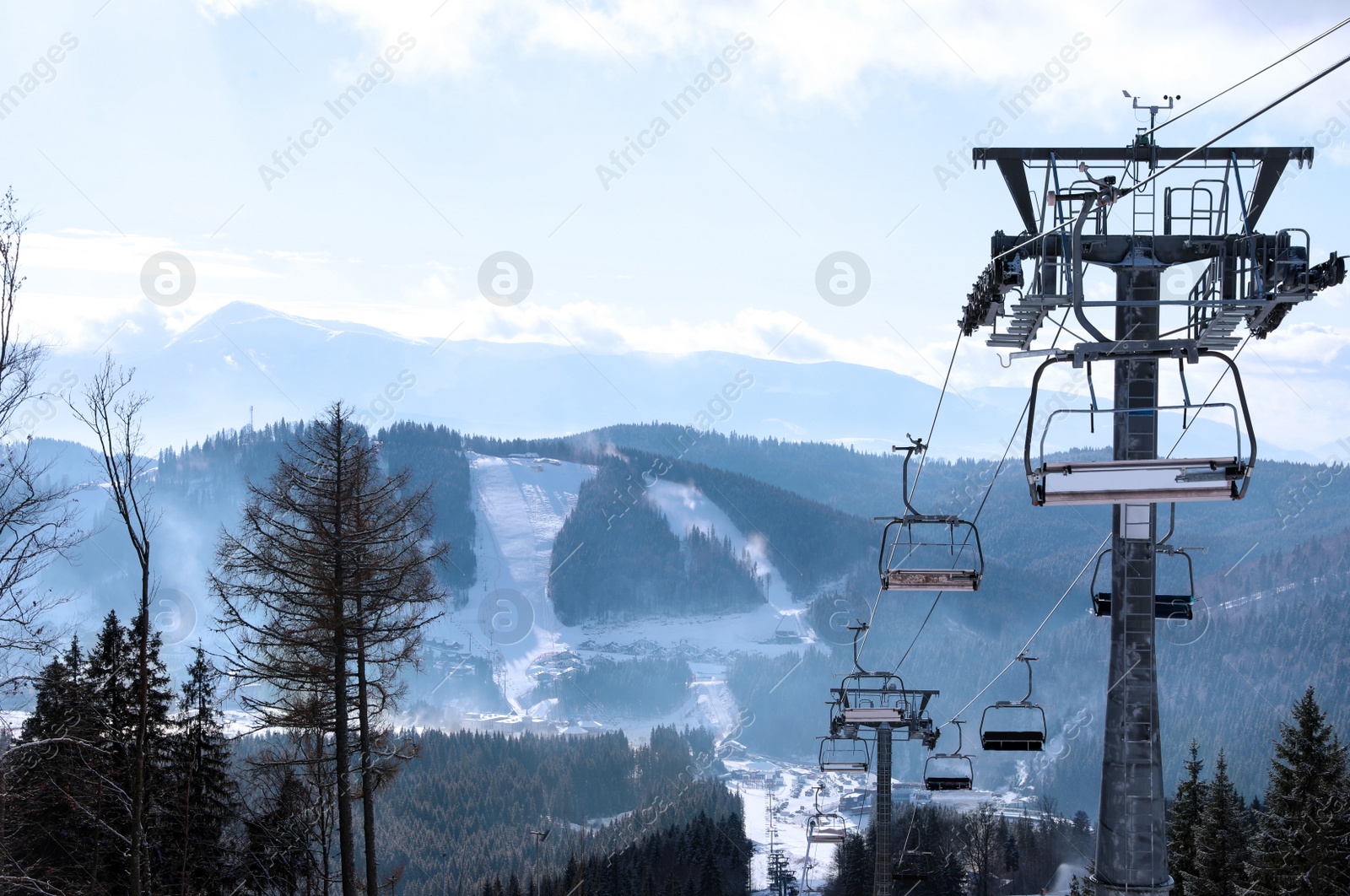 Photo of Beautiful mountain landscape with chairlift. Winter vacation