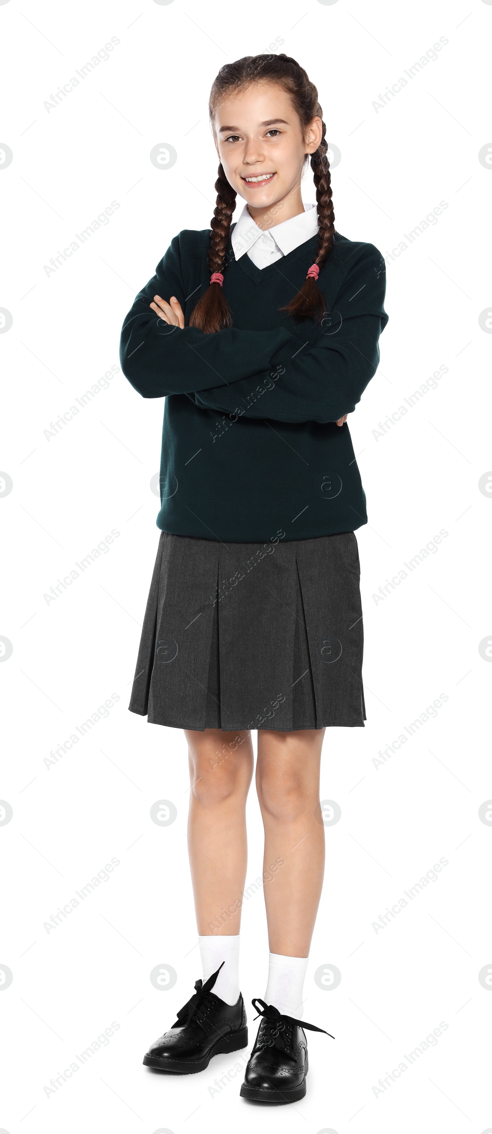 Photo of Teenage girl in stylish school uniform on white background