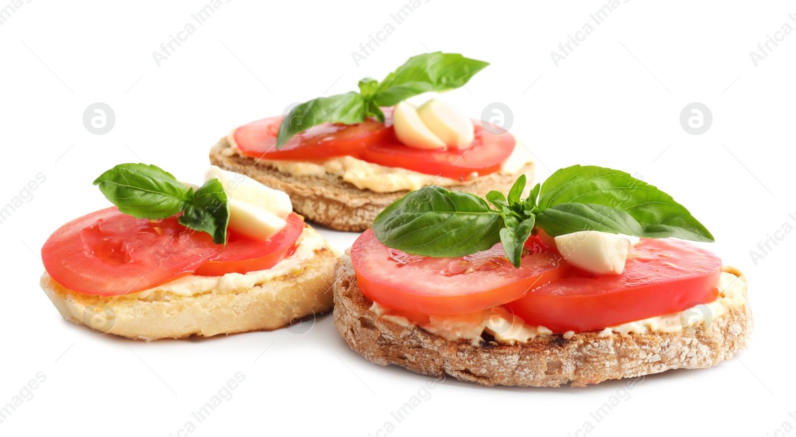 Photo of Tasty fresh tomato bruschettas on white background