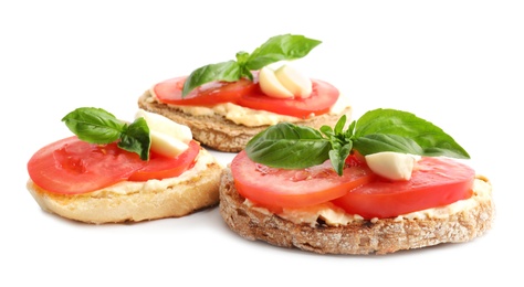 Photo of Tasty fresh tomato bruschettas on white background