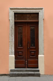 Photo of View of building with vintage wooden door. Exterior design