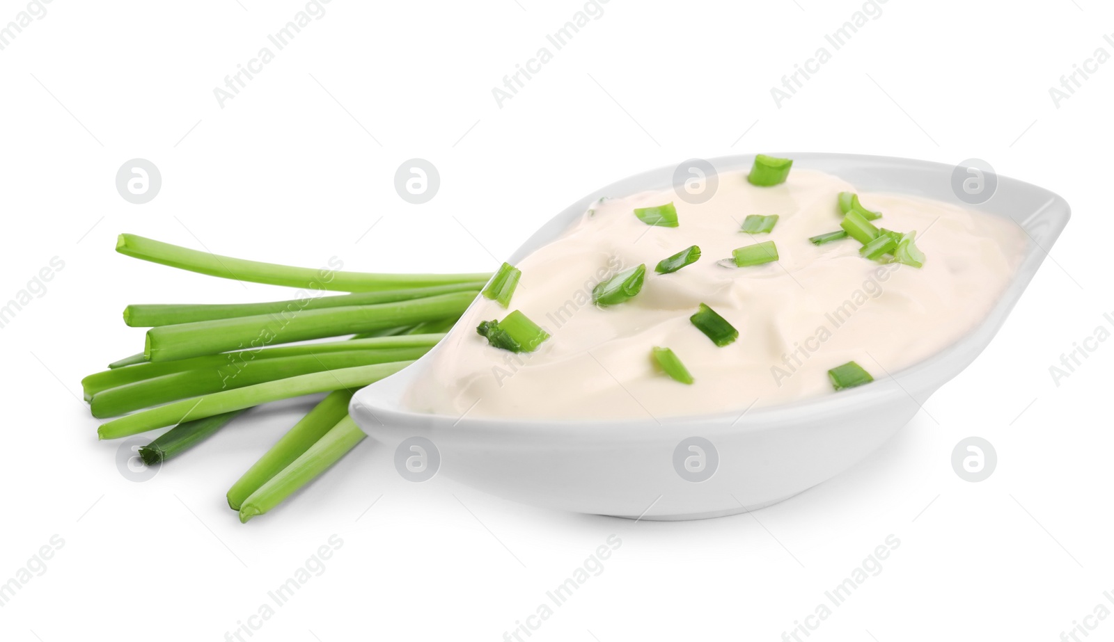 Photo of Fresh sour cream with onion on white background