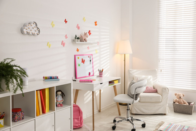 Photo of Modern child room interior with stylish furniture