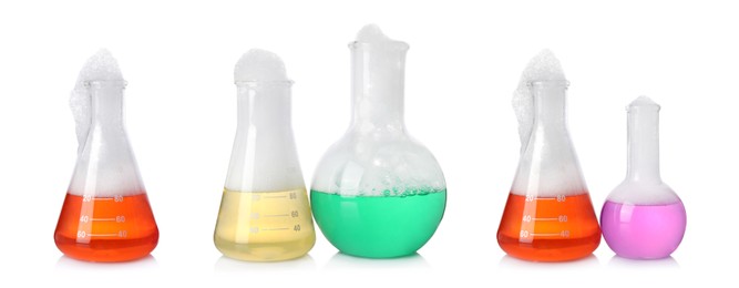 Image of Set of laboratory flasks with colorful liquids and foam on white background. Chemical reaction