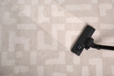 Image of Vacuuming dirty carpet. Clean area after using device, top view