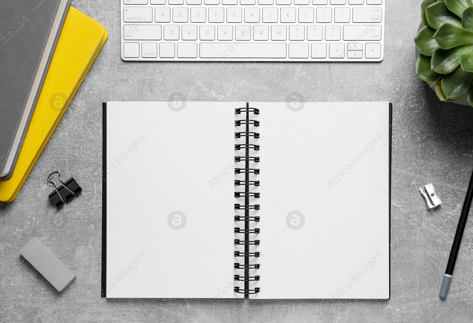 Photo of Flat lay composition with stylish notebooks on grey table