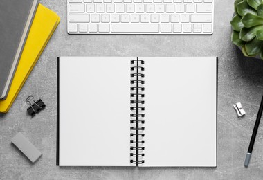 Photo of Flat lay composition with stylish notebooks on grey table