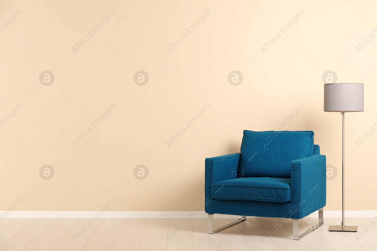 Photo of Stylish living room interior with comfortable armchair and space for text