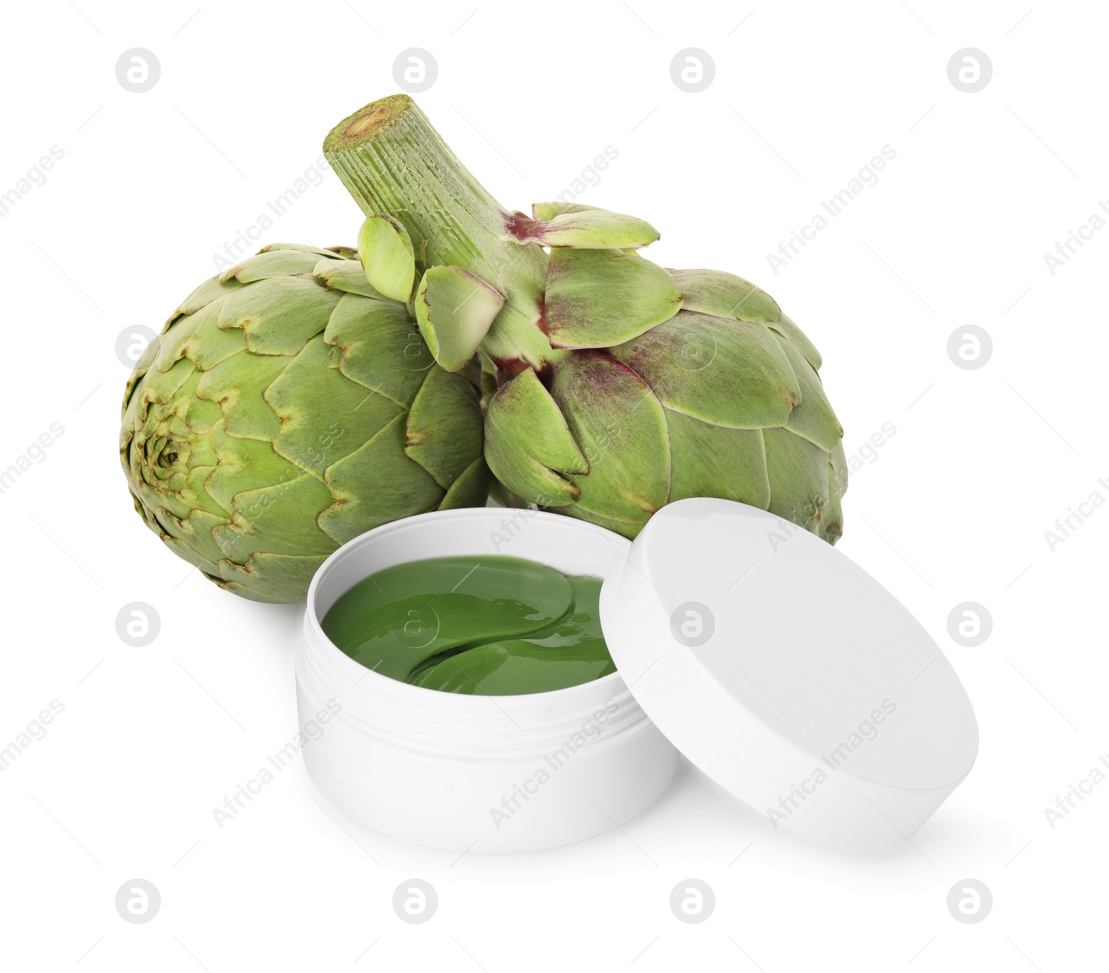 Photo of Package of under eye patches and artichokes on white background. Cosmetic product