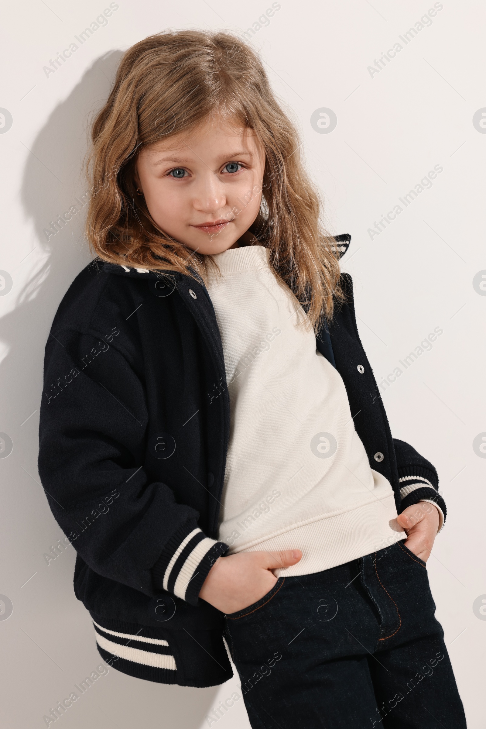 Photo of Fashion concept. Stylish girl posing on white background