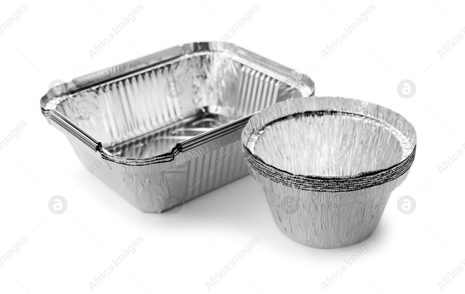 Photo of Many different aluminum foil containers isolated on white