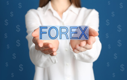 Image of Businesswoman on blue background, closeup. Forex trading