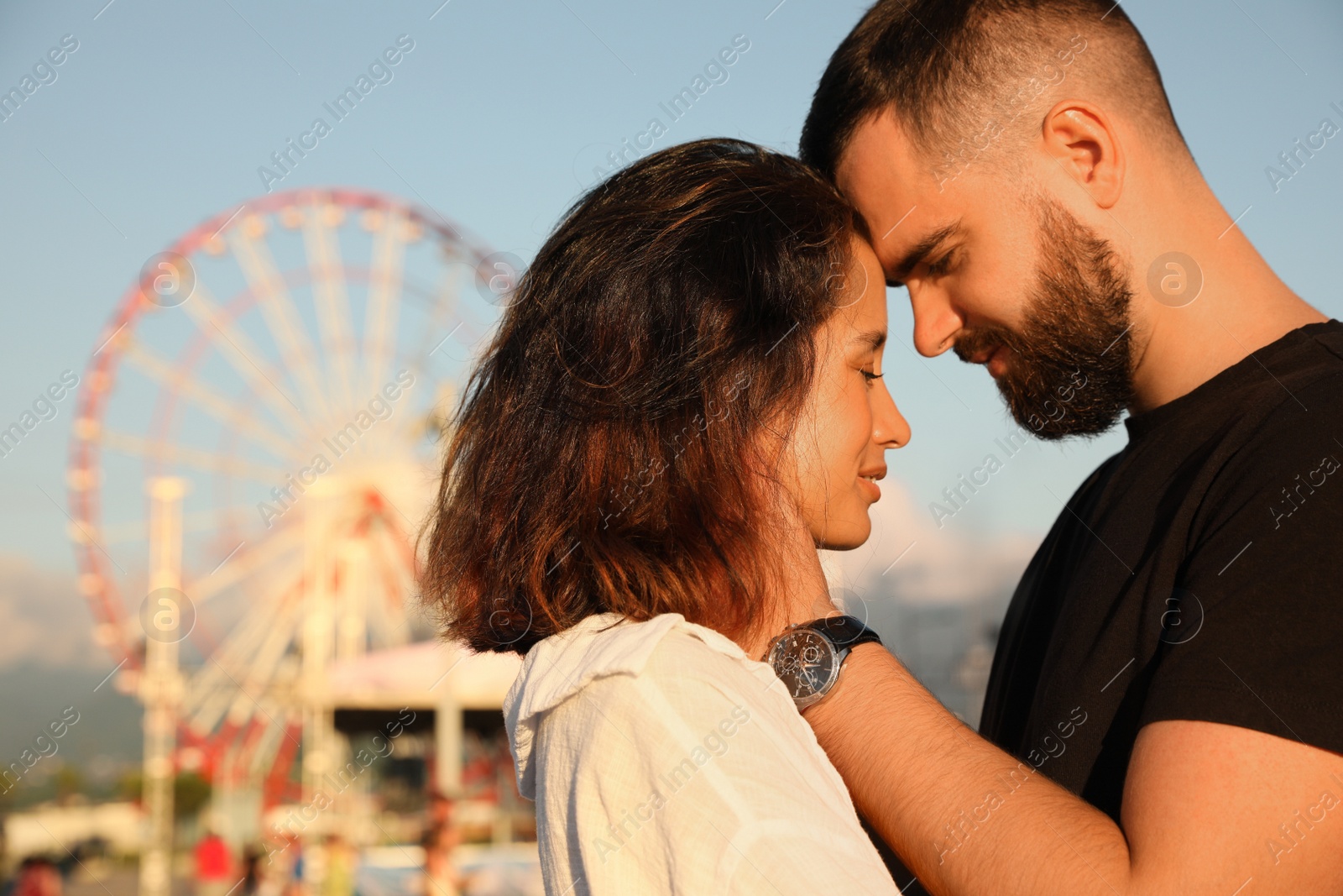 Photo of Happy young couple together in amusement park