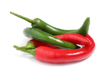 Photo of Ripe hot chili peppers on white background