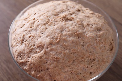 Fresh sourdough in bowl on wooden table, closeup