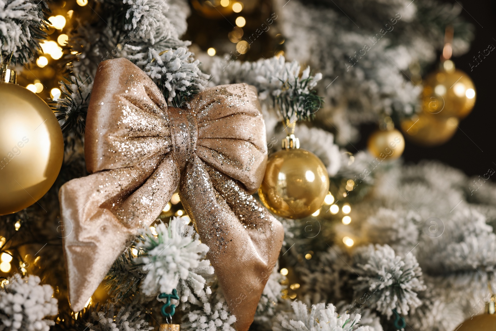 Photo of Beautiful decorated Christmas tree with baubles and lights as background, closeup