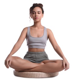 Photo of Beautiful African-American woman meditating on white background