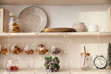 Shelving unit with kitchenware and Christmas decor