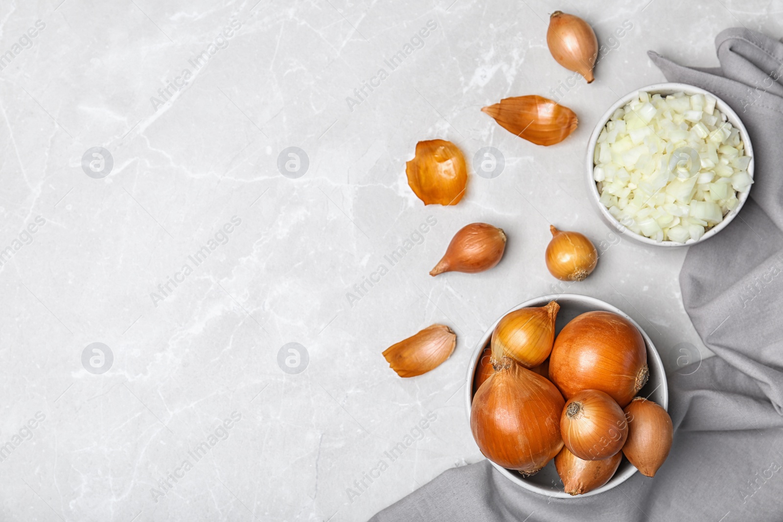 Photo of Flat lay composition with fresh ripe onions on table