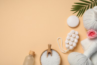 Flat lay composition of herbal bags and spa products on beige background, space for text