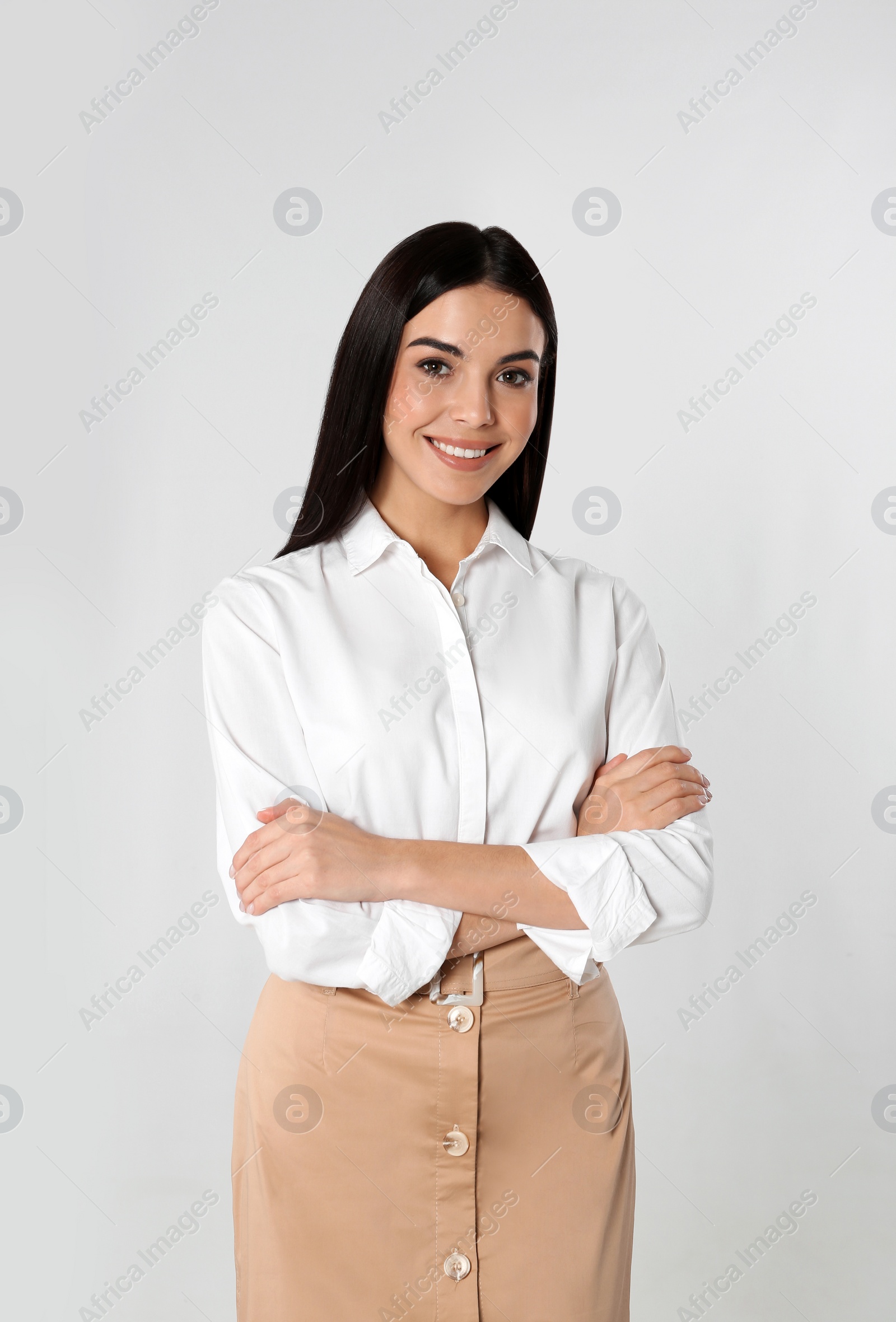 Photo of Portrait of young businesswoman on white background