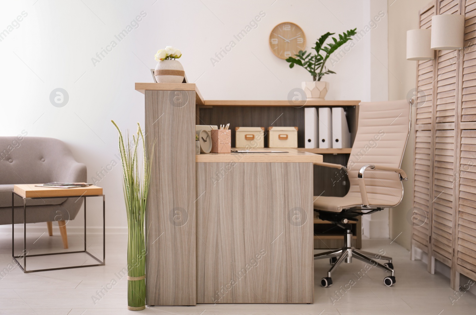 Photo of Receptionist desk in hotel. Workplace interior