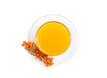 Photo of Sea buckthorn tea and fresh berries isolated on white, top view