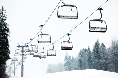 Ski lift at mountain resort. Winter vacation