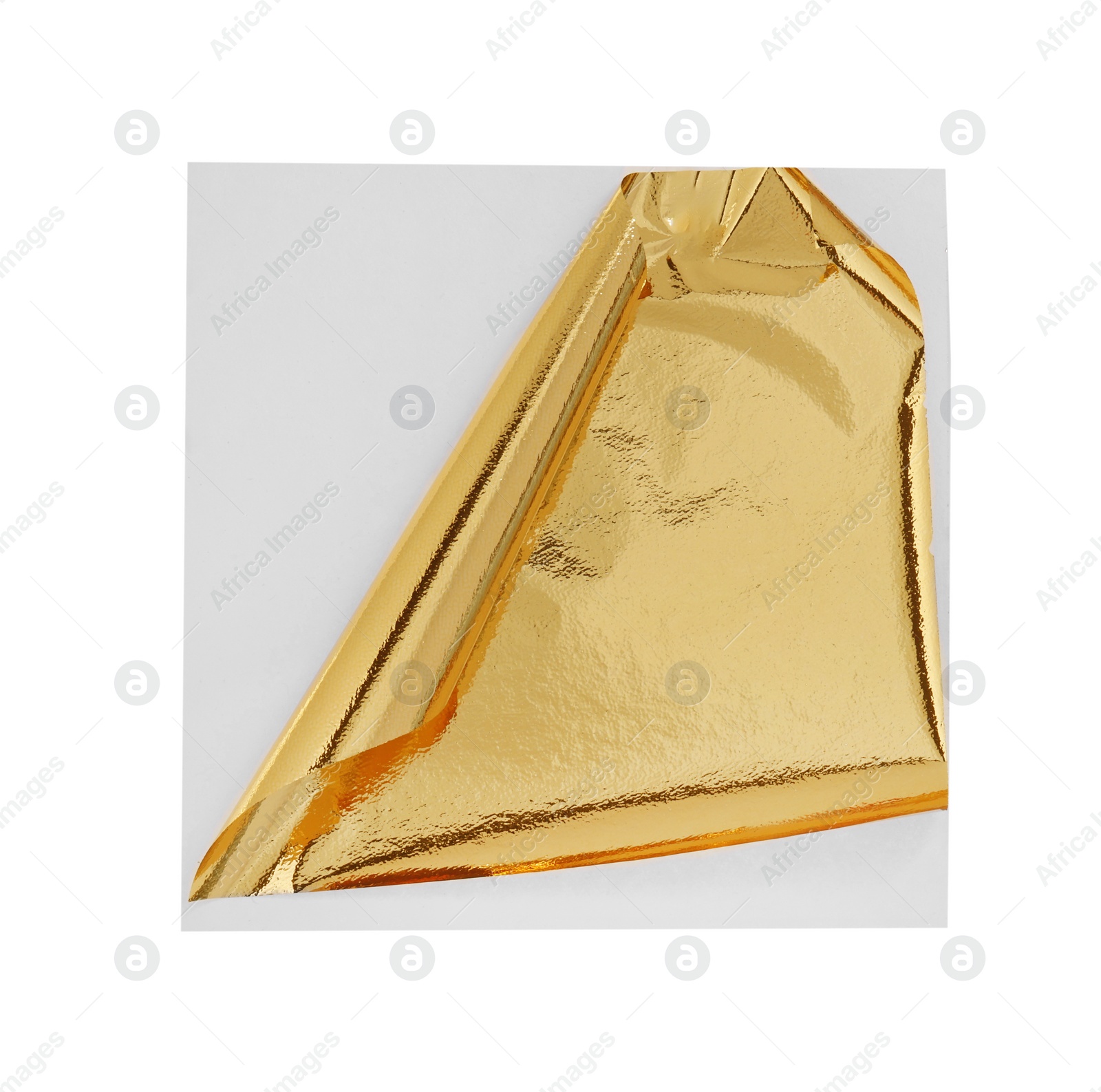 Photo of Edible gold leaf sheet isolated on white