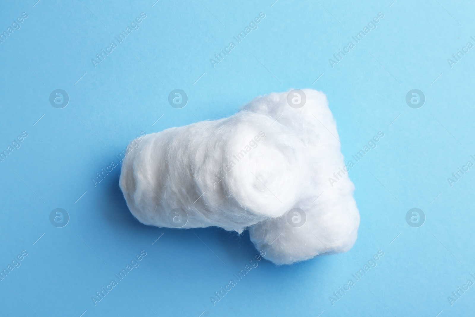 Photo of Clean cotton rolls on blue background, top view