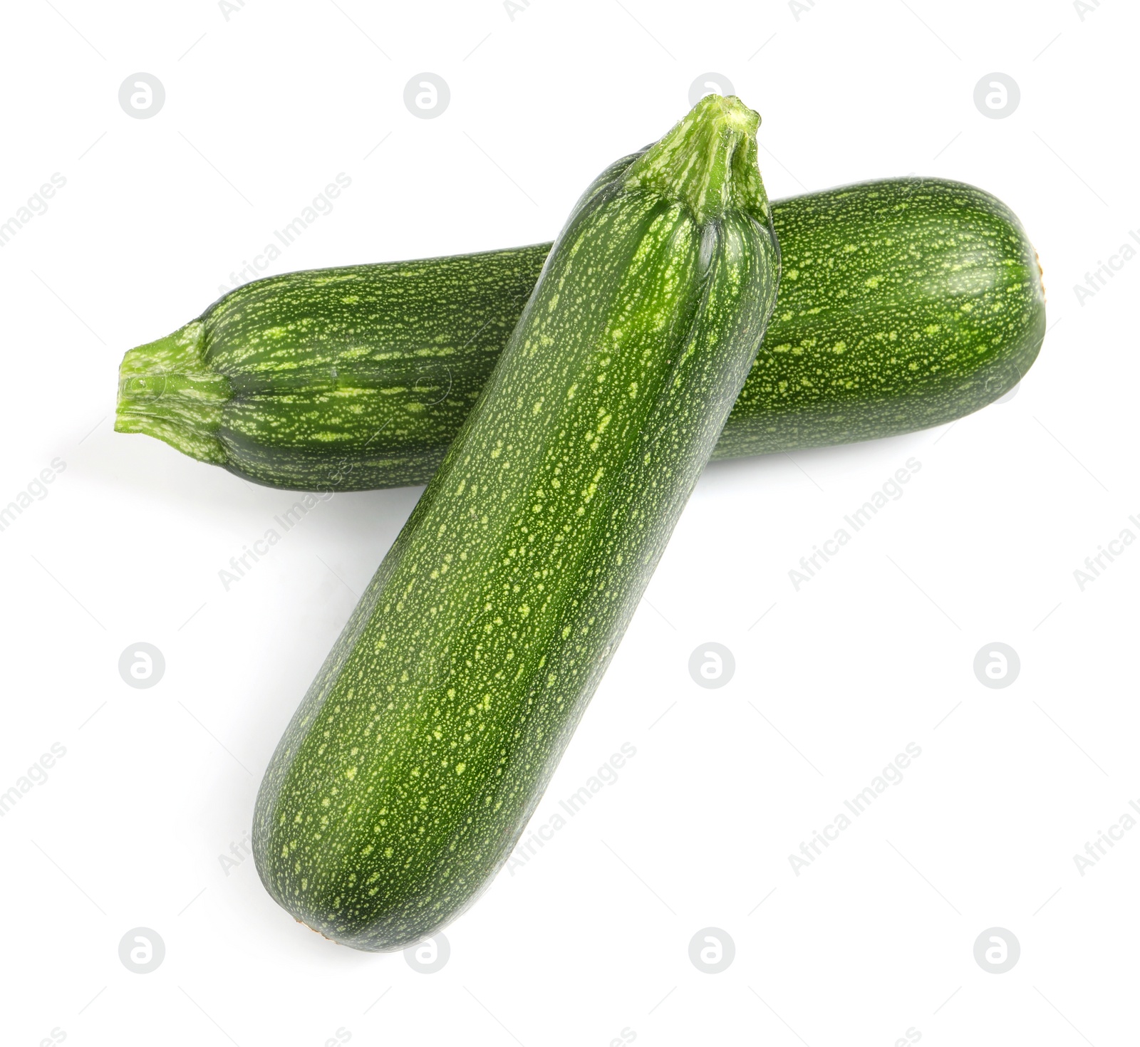 Photo of Raw ripe zucchinis on white background, top view