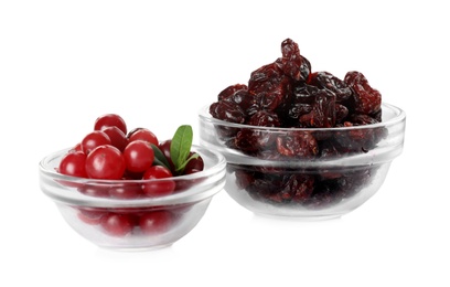 Photo of Fresh and dried cranberries in glass bowls on white background