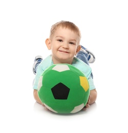 Photo of Cute little child with soft soccer ball on white background. Playing indoors