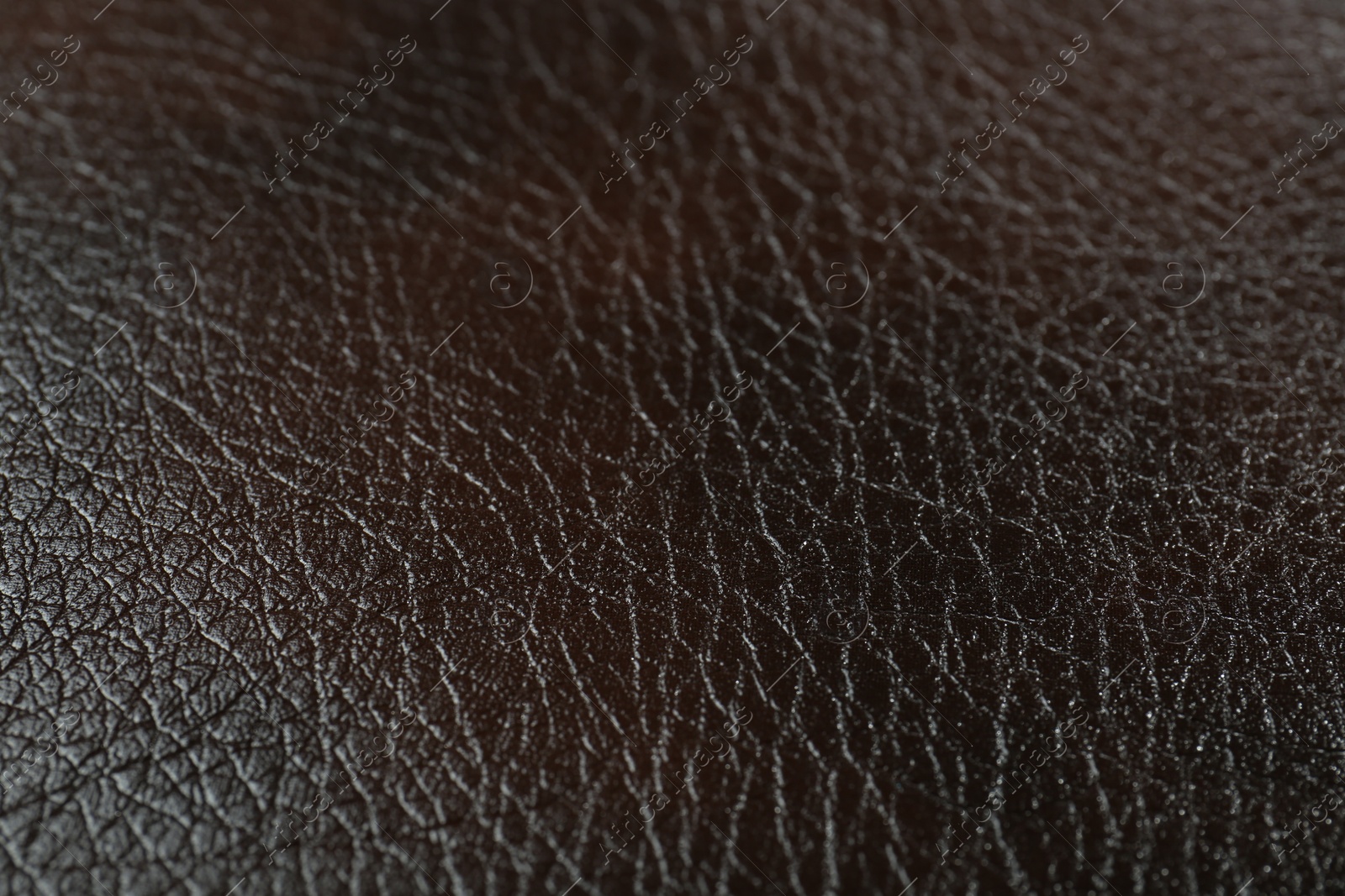 Photo of Texture of brown leather as background, closeup