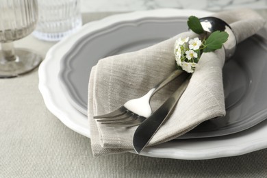 Photo of Stylish setting with cutlery and plates on table, closeup