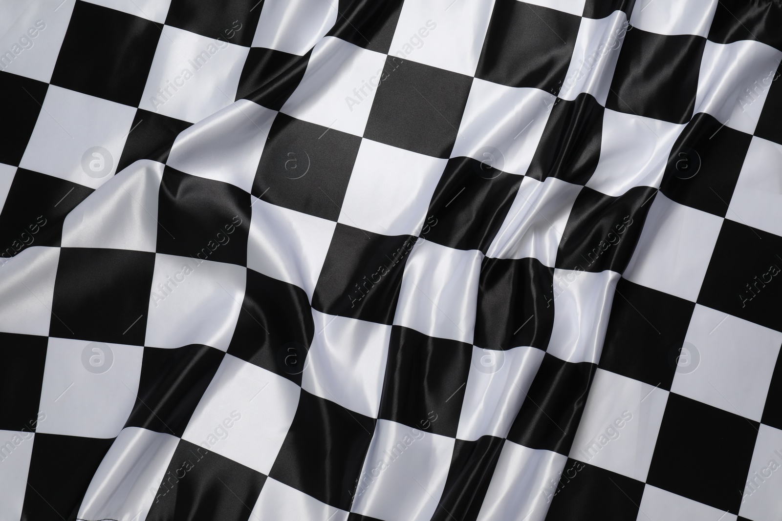 Photo of Checkered satin fabric as background, closeup view