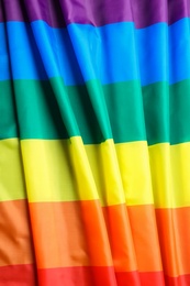 Photo of Bright rainbow gay flag as background. LGBT community