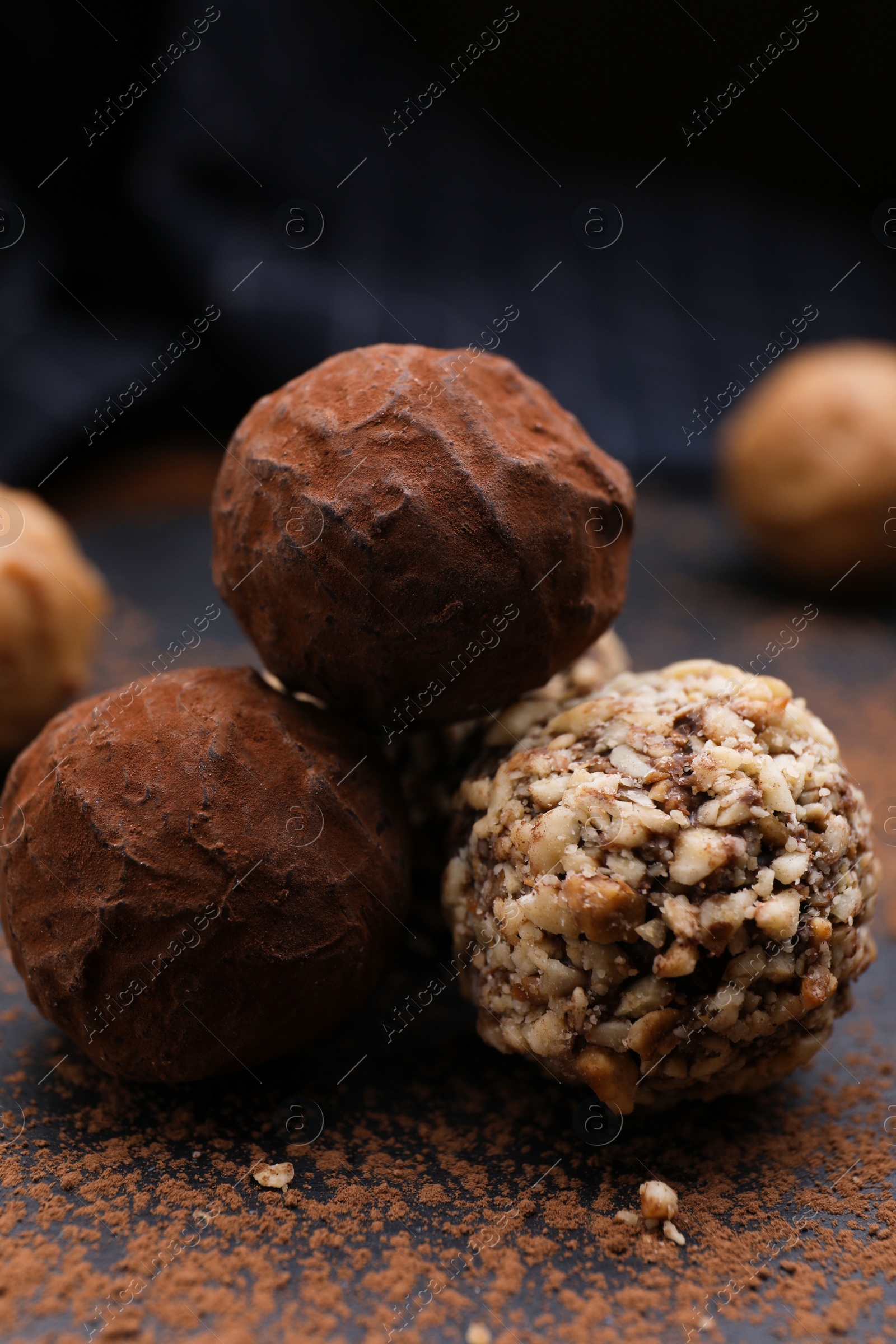 Photo of Different tasty chocolate candies on table, closeup