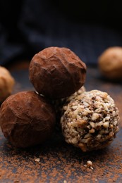 Different tasty chocolate candies on table, closeup