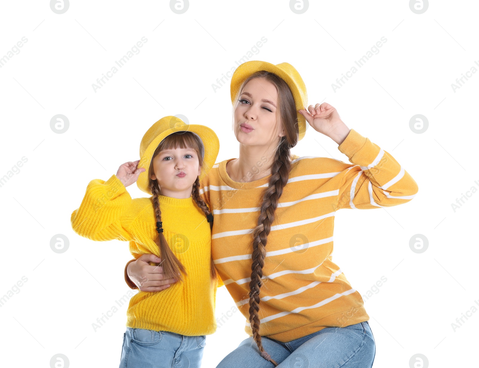 Photo of Happy woman and daughter in stylish clothes on white background