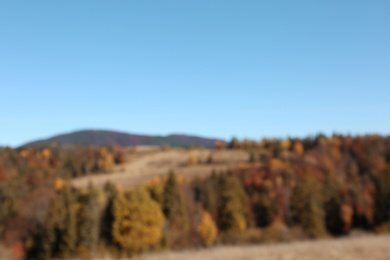 Picturesque landscape with beautiful forest and mountains, blurred view