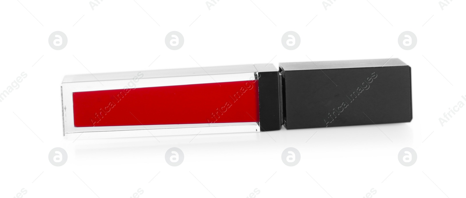 Photo of One red lip gloss isolated on white. Cosmetic product