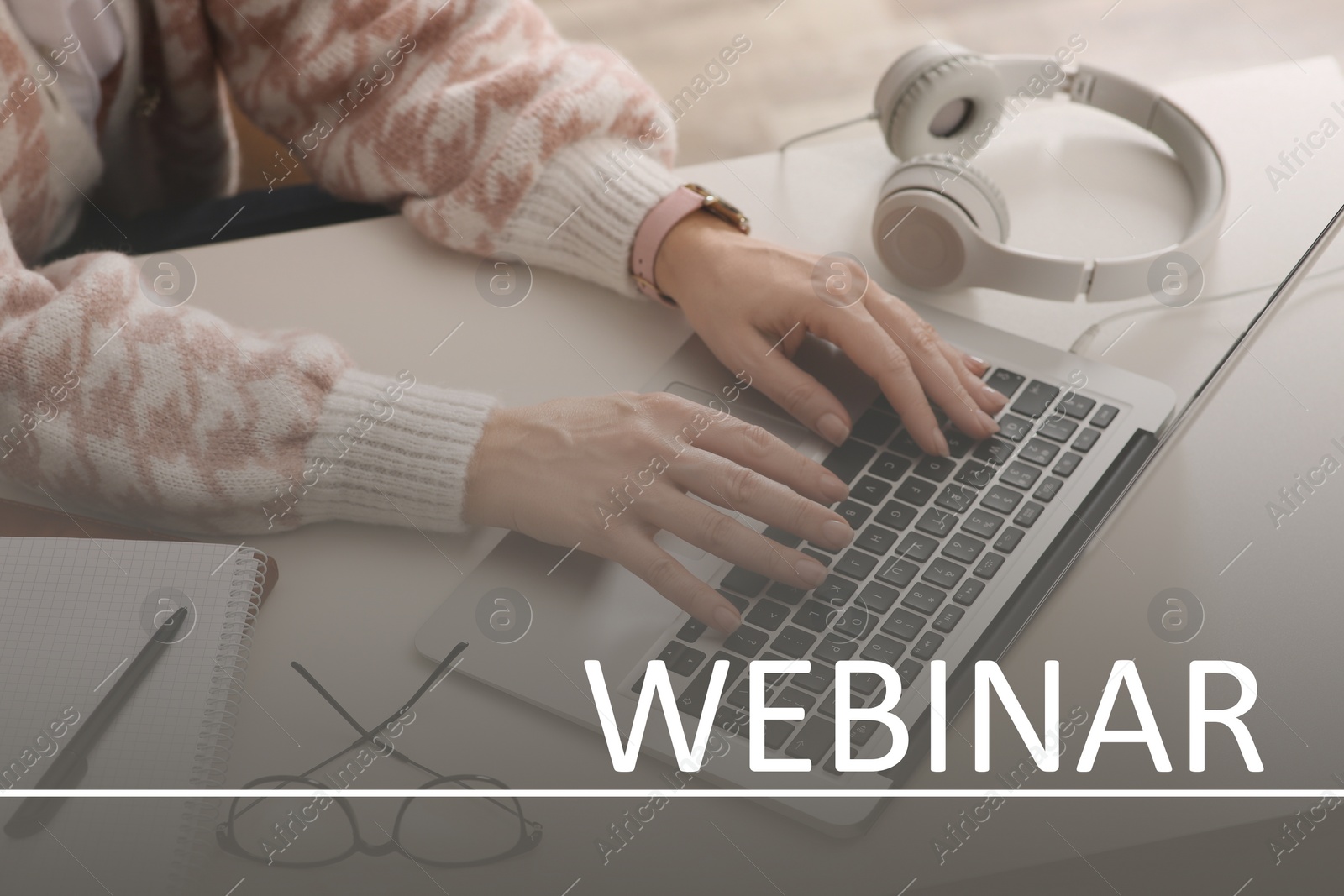 Image of Webinar concept. Woman working with laptop at table indoors, closeup