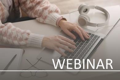 Webinar concept. Woman working with laptop at table indoors, closeup