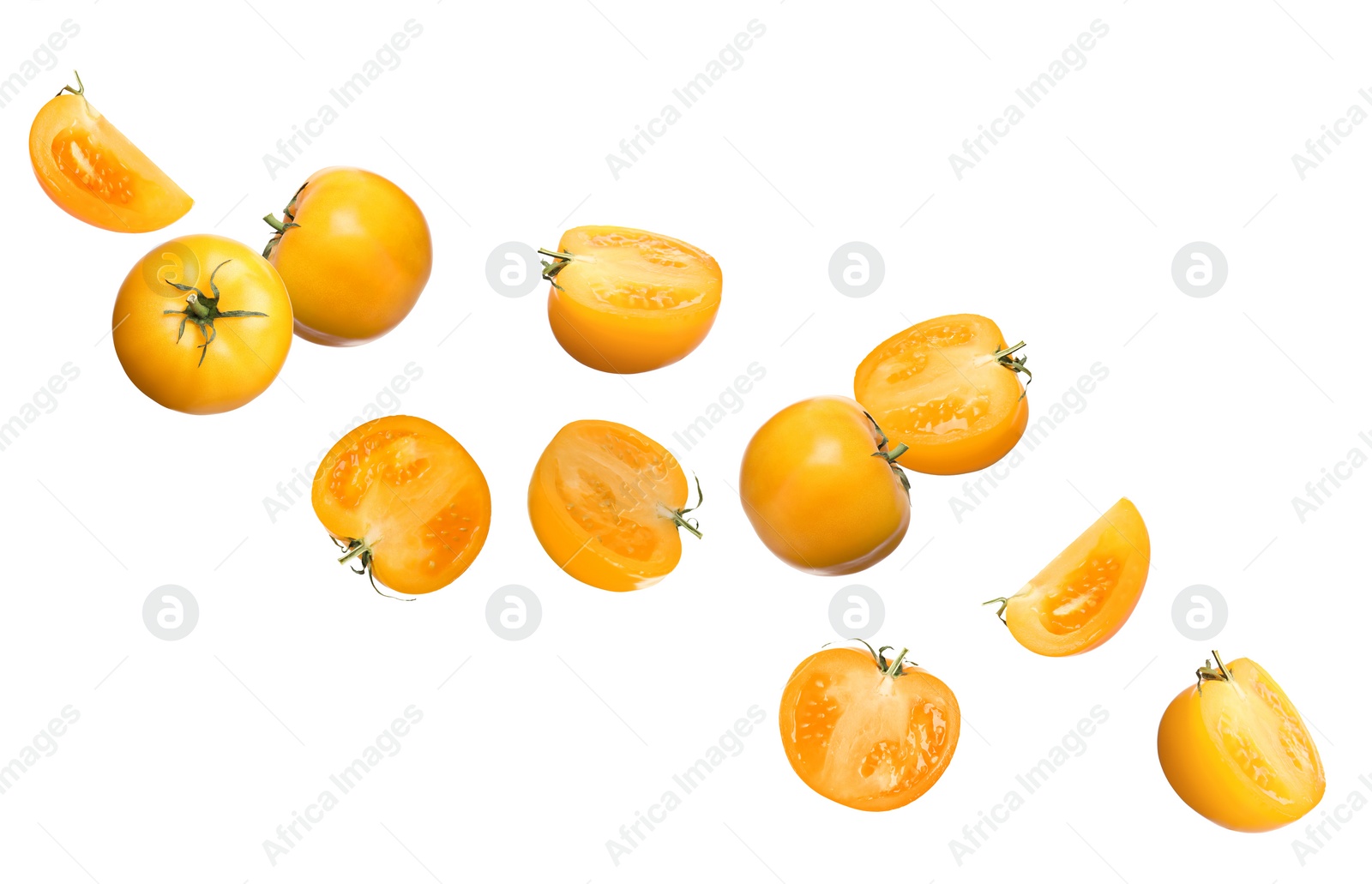 Image of Fresh ripe yellow tomatoes flying on white background