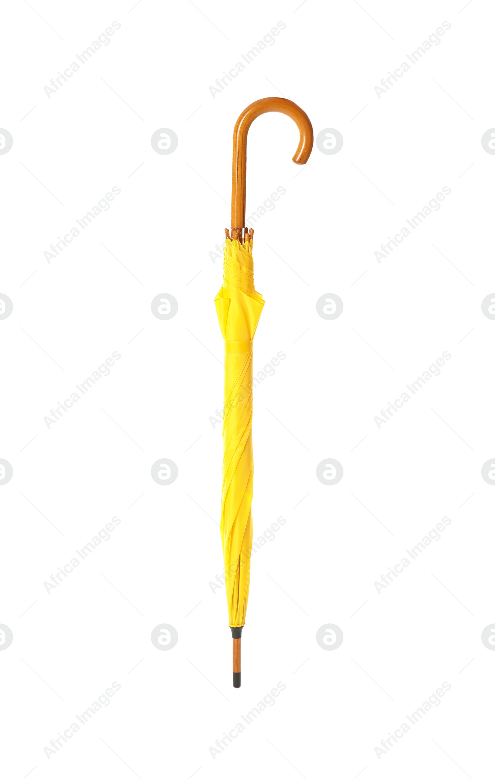 Photo of Modern closed yellow umbrella isolated on white