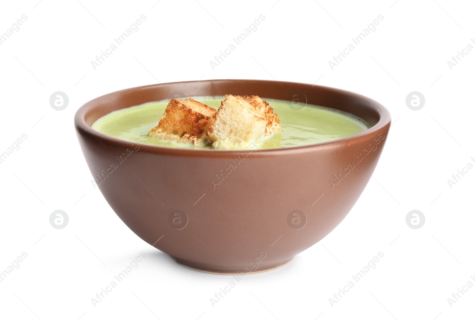 Photo of Delicious broccoli cream soup with croutons isolated on white