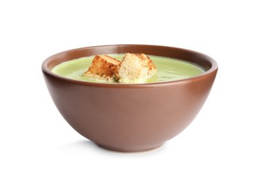 Photo of Delicious broccoli cream soup with croutons isolated on white