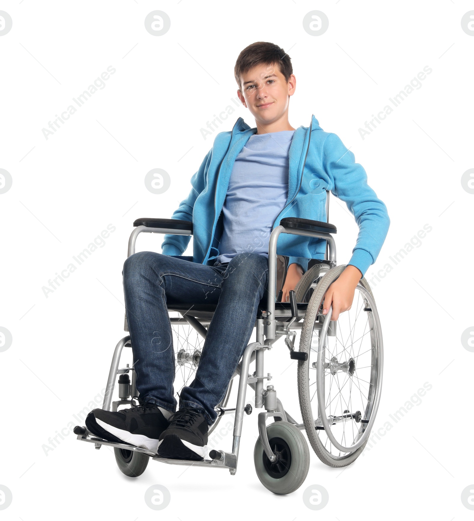 Photo of Teenage boy in wheelchair on white background